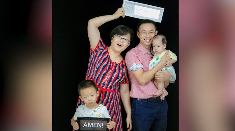 覃德富全家合影。(志愿者提供/记者乔龙)