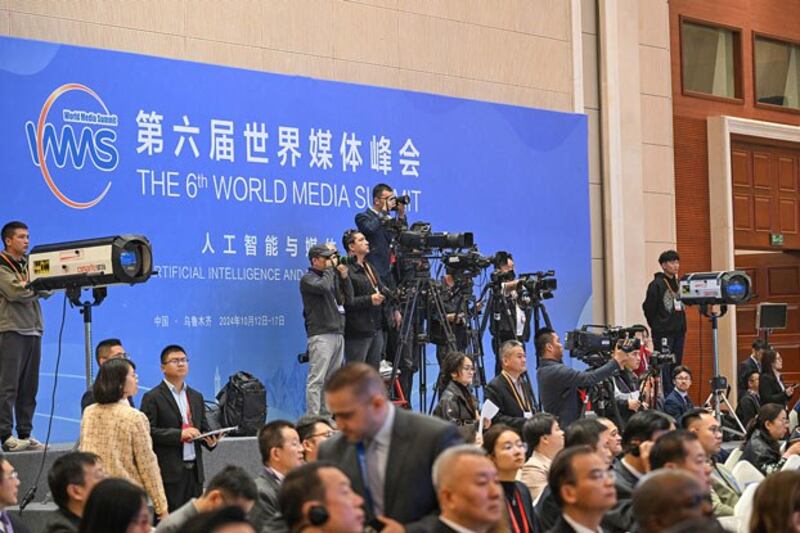 Journalists work at the opening ceremony of the 6th World Media Summit in Urumqi, capital of northwestern China's Xinjiang region, Oct. 14, 2024. (Chen Yehua/Xinhua via Getty Images)