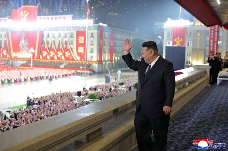 North Korean leader Kim Jong Un gestures during a military parade celebrating the 80th anniversary of the founding of the ruling Workers' Party of Korea in Pyongyang in this image released October 11, 2025 by the North Korean government.