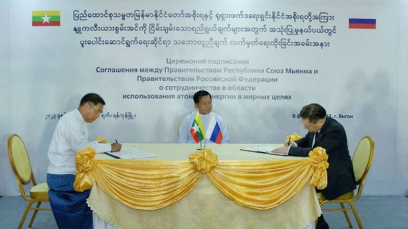Military junta chief Senior Gen. Min Aung Hlaing watches the signing of the agreement between Myanmar and Russia for nuclear cooperation by the junta's Minister for Science and Technology Myo Thein Kyaw [left] and Alexey Likhachev, CEO of Russia's Rosatom state nuclear agency, on Monday, Feb. 6, 2023, in Yangon. Credit: Myanmar military