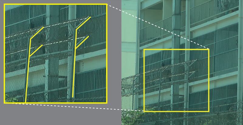 This image released by Amnesty International on June 26, 2025, as part of a report on scam centers in Cambodia shows the “eastern perimeter wall of a scamming compound in Phnom Penh that is heightened and angled towards the interior with barbed or razor wire on the inside to prevent climbing.“