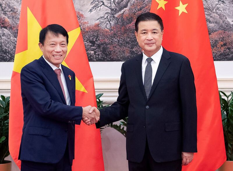China's Minister of Public Security Wang Xiaohong, right, meets with Luong Tam Quang, Vietnam's minister of public security, in Beijing, Aug. 20, 2024. (Li Tao/Xinhua via Getty Images)