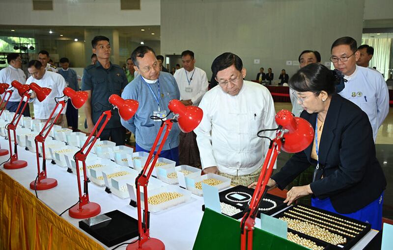 Myanmar junta chief Senior Gen. Min Aung Hlaing looks at pearls at the Myanmar Gems Emporium, Nov. 18, 2024.