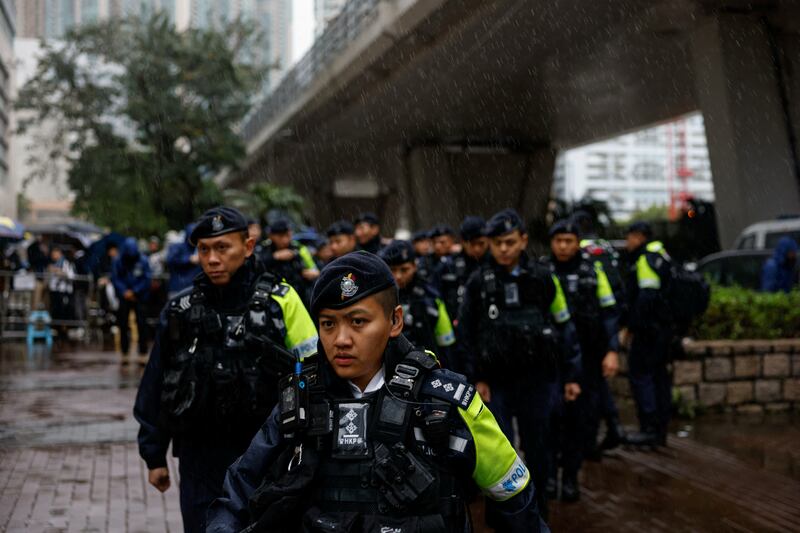 Police patrol outside the West Kowloon Magistrates' Courts building as Jimmy Lai, the founder of the now-defunct pro-democracy newspaper Apple Daily, takes the witness stand for the first time in the national security collusion trial, in Hong Kong, China, Nov. 20, 2024.