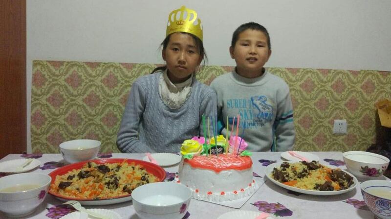 努尔加合浦的妻子帕提玛.别克努尔的两个孩子无依无靠。(家属提供/记者乔龙)