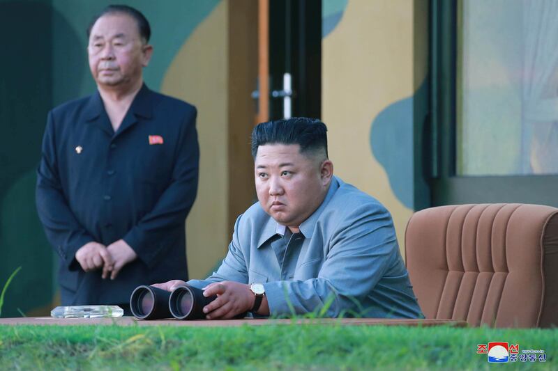 North Korean leader Kim Jong Un watches the test-firing of missiles in an undated picture released on July 26, 2019.