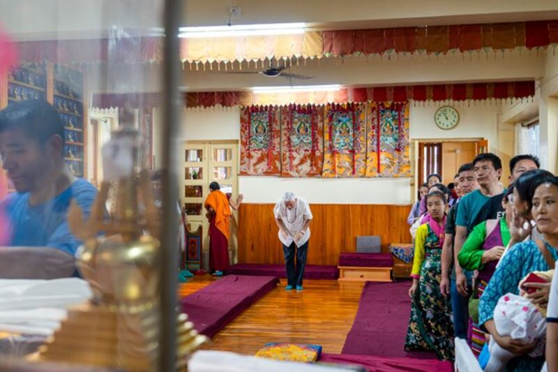 Tibetans line up to offer prayers as they mark the day of Buddha's birth, death and enlightenment at the Tsuklakhang temple complex in Dharamshala, India, May 23, 2024. (Ashwini Bhatia/AP)