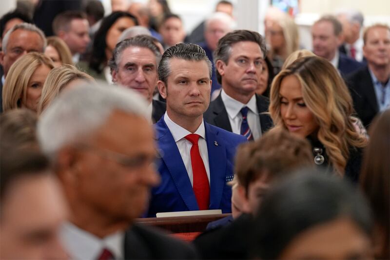 Defense Secretary-nominee Pete Hegseth (center, red tie) attends the service at St. John's Episcopal Church in Washington, Jan. 20, 2025.